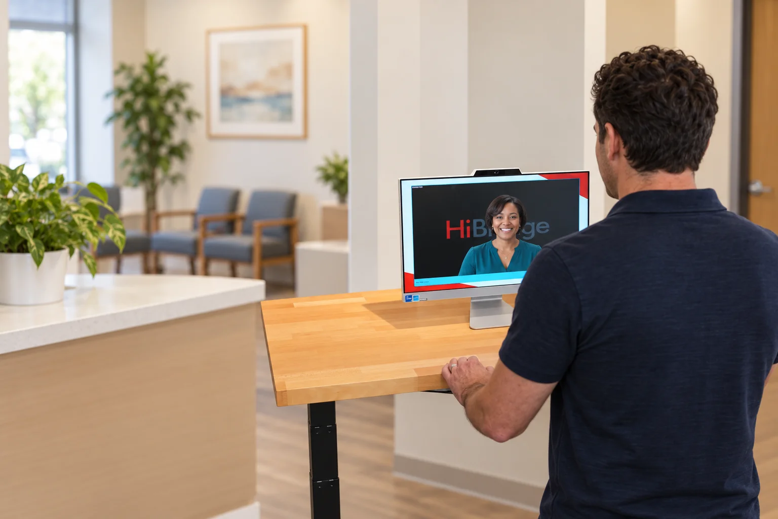A visitor speaking with a real receptionist on a HiBridge screen.