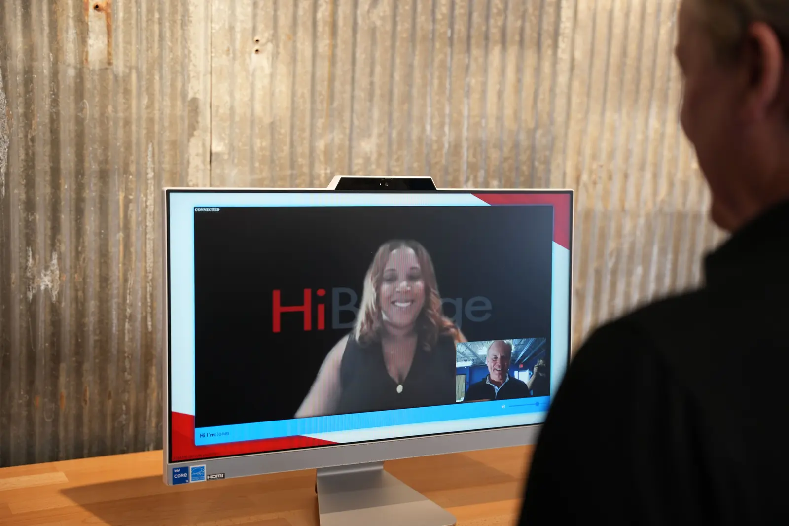 A live receptionist greets a visitor on screen