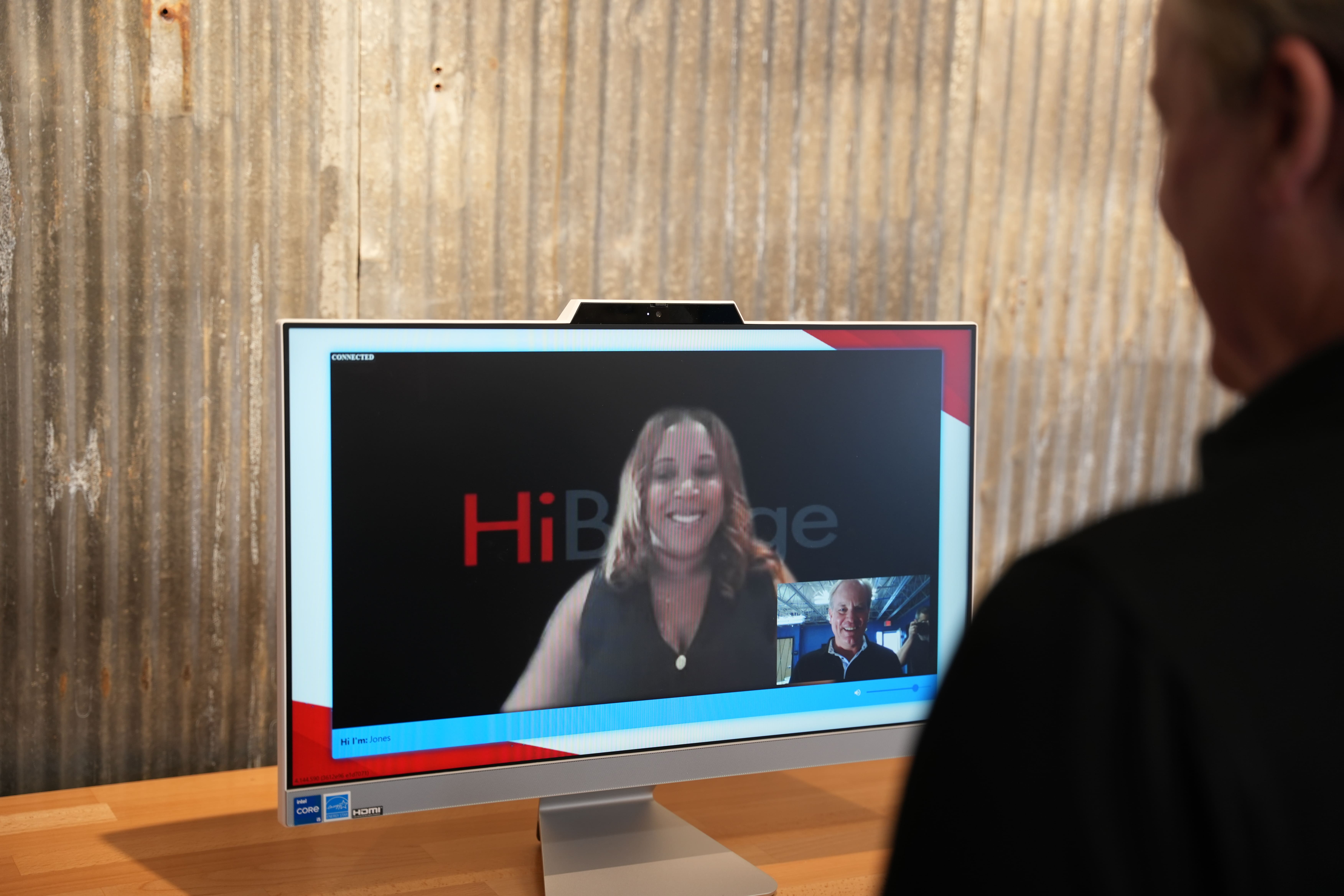 A live receptionist greets a visitor on screen